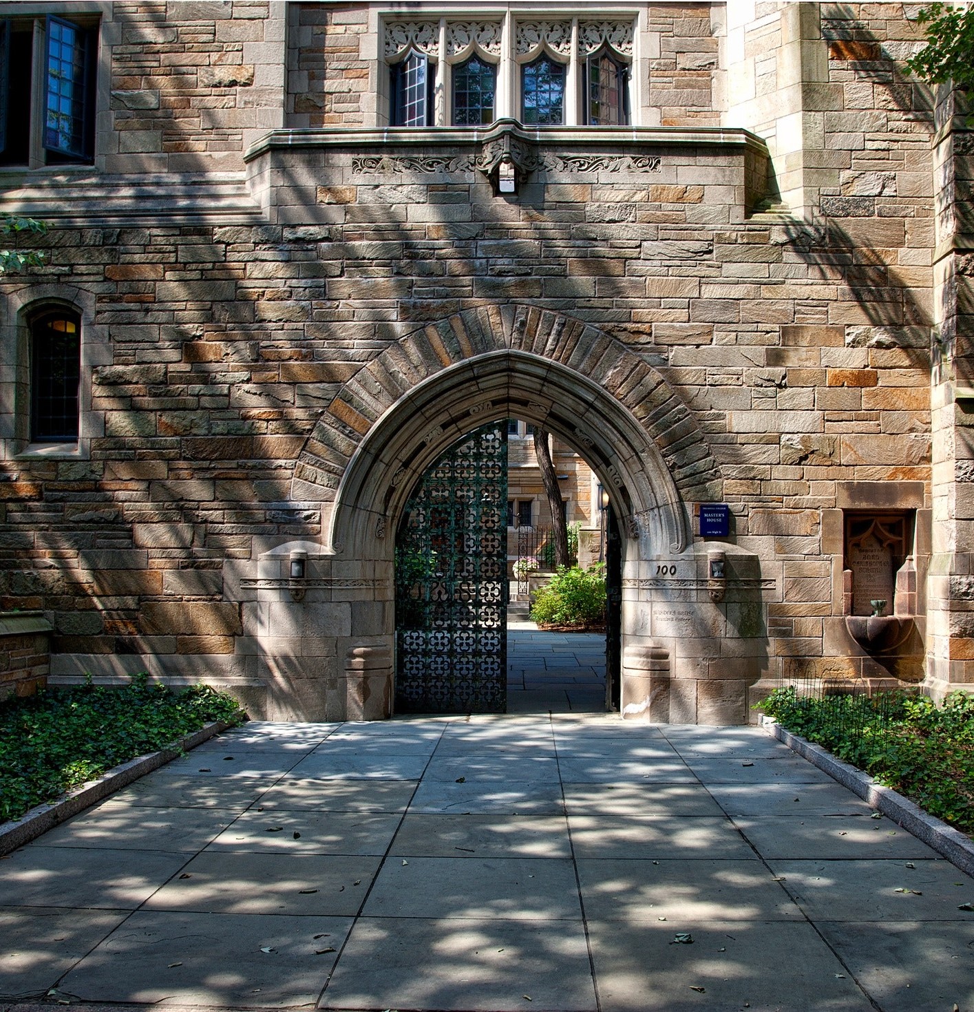 steel-gate-of-brown-brick-building-159490 crop